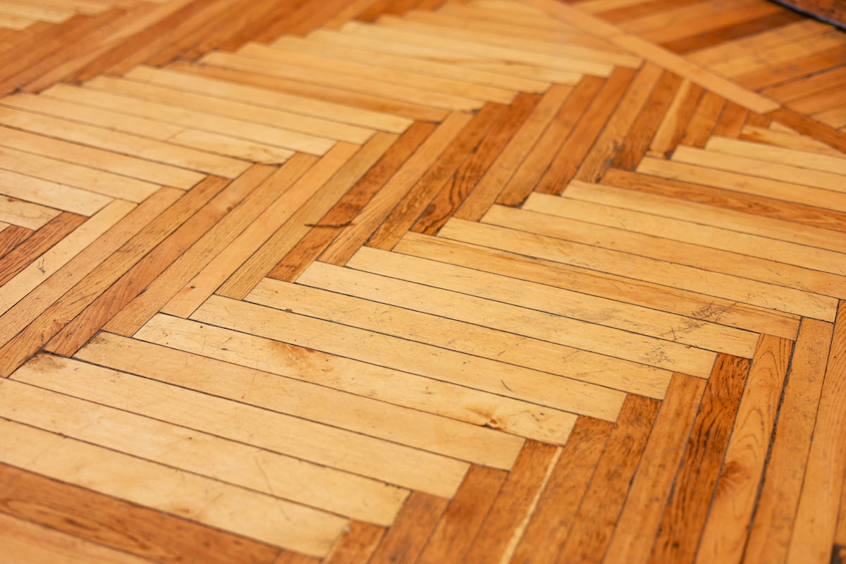 Close-up of a wooden parquet floor pattern.