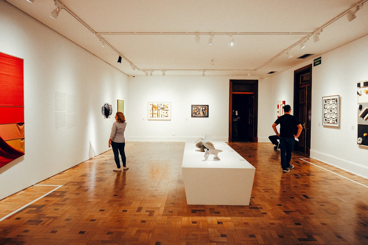 People viewing art in a modern gallery