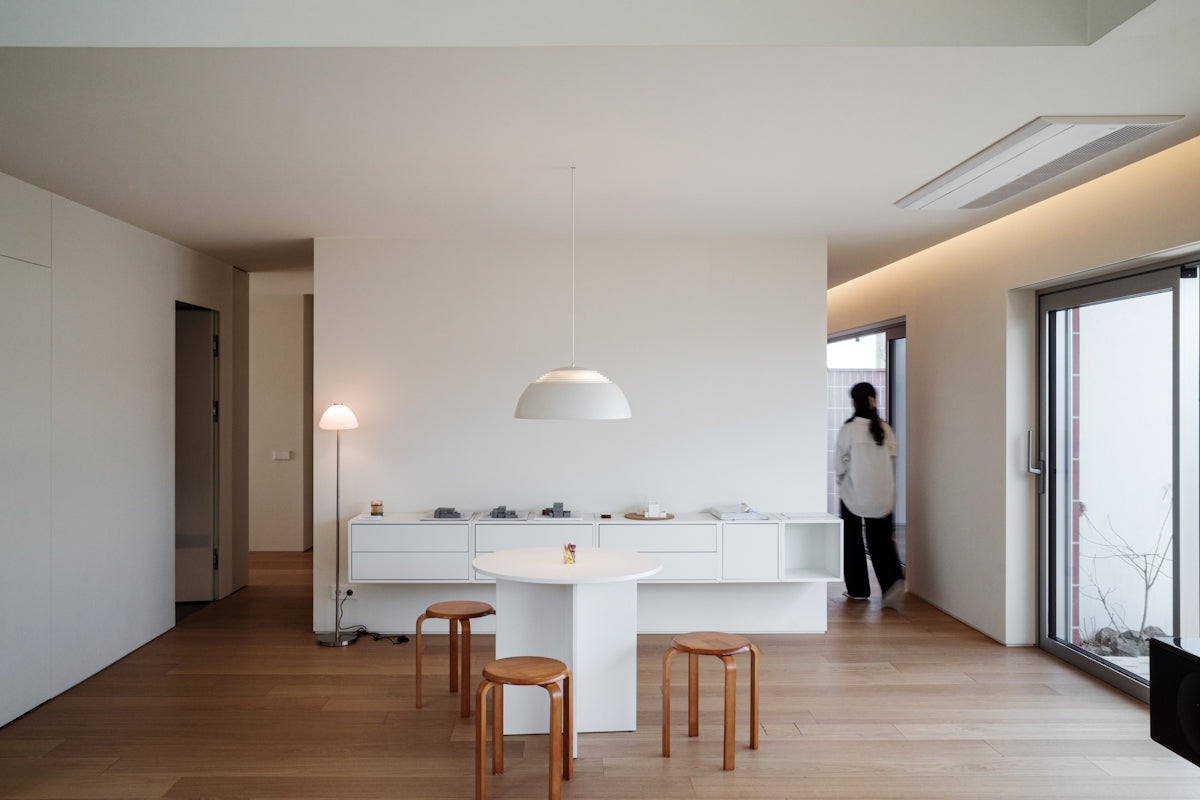 Modern minimalist living room with white furniture
