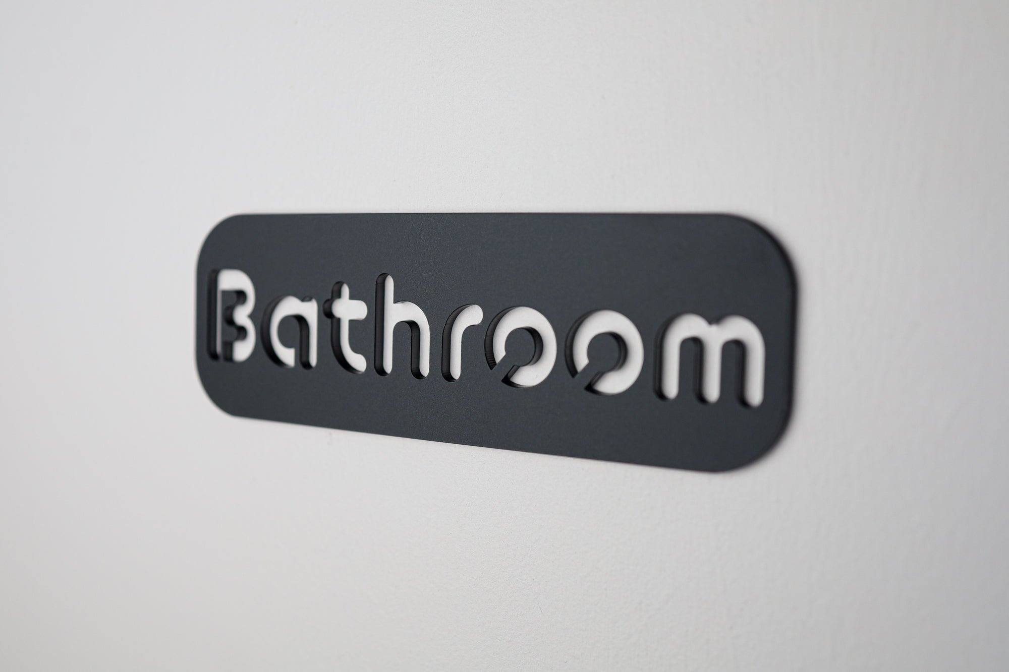 High-quality black "Bathroom" sign with a clean, modern design and cut-out lettering.